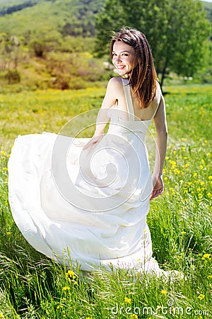 Beautiful bride girl in the yellow field Stock Photo