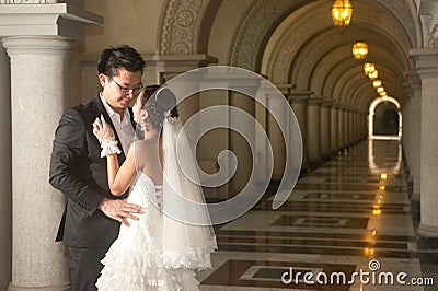 A beautiful bride and handsome groom at Christian church during wedding. Stock Photo