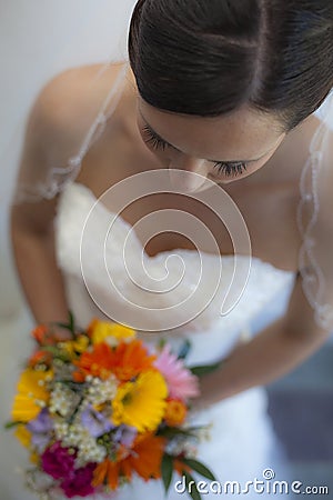 Beautiful Bride holding flowers Stock Photo