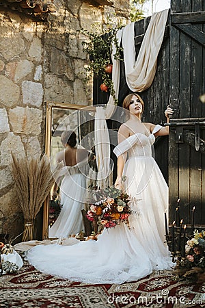 Beautiful bride in rustic arrangement Stock Photo