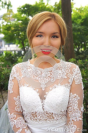 Beautiful bride in a white wedding dress Stock Photo