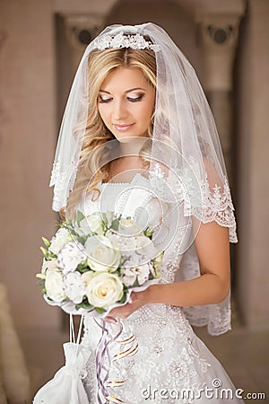 https://thumbs.dreamstime.com/x/beautiful-bride-woman-bouquet-flowers-wedding-makeup-hairstyle-bridal-veil-girl-wearing-white-dress-posing-59969783.jpg