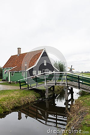 Beautiful Bridge over a Canal with a Traditional Building in Zaanse Schans Netherlands Editorial Stock Photo