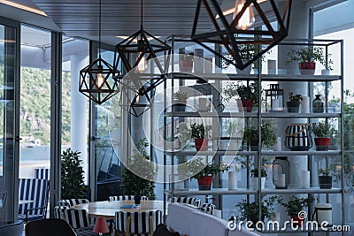 Inside the cafe on the beach with beautiful chandeliers Stock Photo