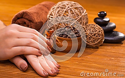 Beautiful brown manicure on a bamboo background Stock Photo