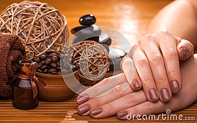 Beautiful brown manicure on a bamboo background Stock Photo