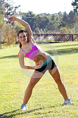 Beautiful Brunette Ahtlete Stretches Outdoors (4) Stock Photo