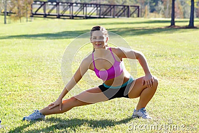 Beautiful Brunette Ahtlete Stretches Outdoors (7) Stock Photo