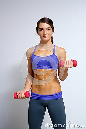 Beautiful Brunette Athlete with Hand Weights (1) Stock Photo