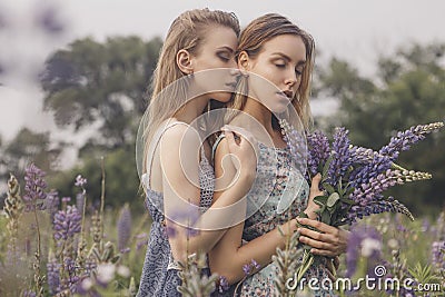 Beautiful brunette fit slim fragile two women with clear flawless skin and waved hair in sensual summer dress in the middle of me Stock Photo