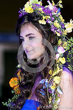 Beautiful brunette with a floral chaplet on a head Editorial Stock Photo