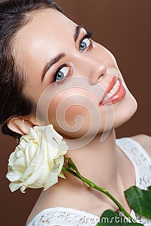 Beautiful brunette girl with natural glowing makeup Stock Photo