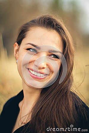 A beautiful brunette girl smiling. autumn. Art photo Stock Photo