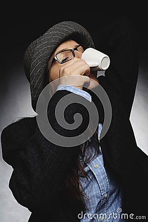 Beautiful brunette with hat and glasses posing in studio in various positions and industry-specific representations photo stock. Stock Photo