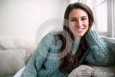 Beautiful brunette with perfect white teeth happy after dental visit, smiling in bright room, home healthy lifestyle Stock Photo