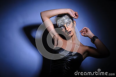 Beautiful brunette in strong pose with hard light Stock Photo