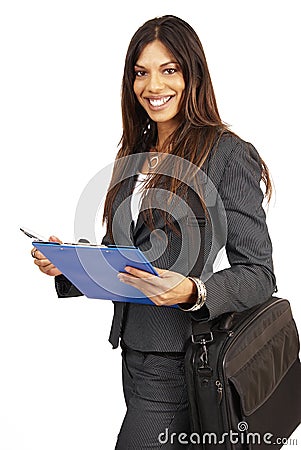 Beautiful brunette woman holding a clipboard Stock Photo