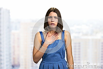 Beautiful brunette woman suffering from cough. Stock Photo