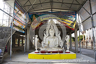 Beautiful buddha statue and renovate build ubosot ordination hall at construction site for thai people respect praying donate in Editorial Stock Photo