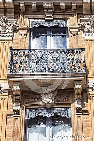 Beautiful building detail. Ornate facade with iron balconies. Toulouse, France Stock Photo