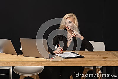 Beautiful business lady is looking at camera and smiling Stock Photo