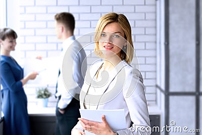Beautiful business woman. business colleagues analyzing financial figures on a graphs Stock Photo