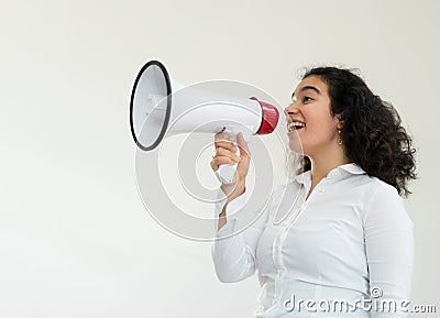 Beautiful business woman with curly hair holding a megaphone Stock Photo