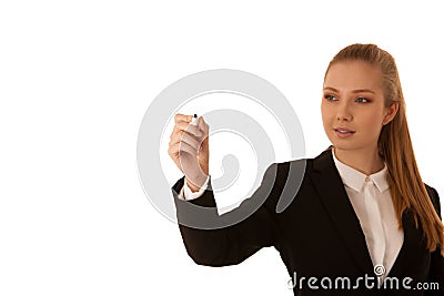 Beautiful business woman draws with marker on virtual screen with copy space for additional graphic Stock Photo