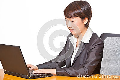 Beautiful business woman working on computer Stock Photo