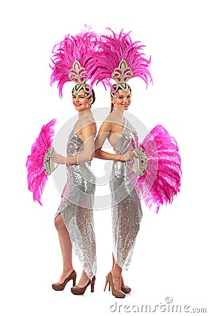 Beautiful cabaret dancers in costumes with rhinestones and purple feathers isolated on white Stock Photo
