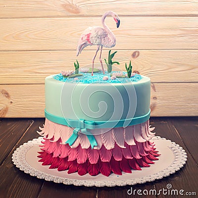 Beautiful cake, decorated with a figure of pink flamingos in the pond. Concept of the Original design of desserts Stock Photo