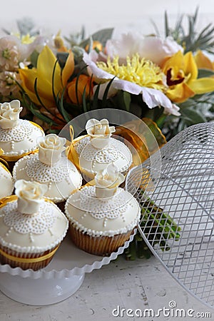 Beautiful cakes and bridal bouquet in orange tones Stock Photo