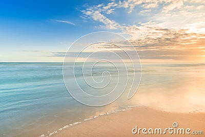 Beautiful calmness sunset on the tropical beach in relaxing time Stock Photo