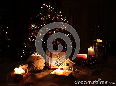 Beautiful candles are lighting up X-mas and New Year night mistery. Editorial Stock Photo