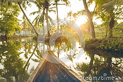 Beautiful canoe ride at ashtamudi lake at Dawn. Kollam district, Kerala, India. Stock Photo