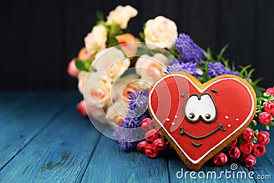 Beautiful card with a red heart smiley cookies on the background Stock Photo