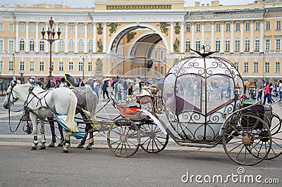 Beautiful carriage on Palace Square. People in carriage at Palace Square near Winter Palace of St. Petersburg. Summer 2016. Editorial Stock Photo