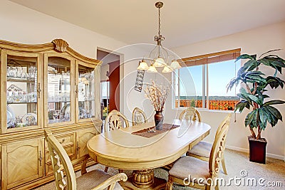 Beautiful carved wood dining table set in bright room Stock Photo