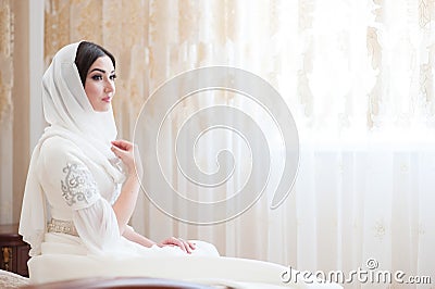 Beautiful caucasian bride in traditional dress Stock Photo