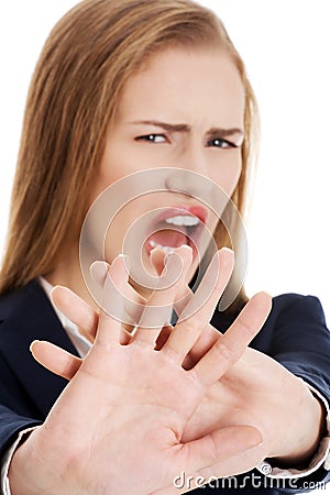 Beautiful caucasian business woman shows rejection and screams. Stock Photo