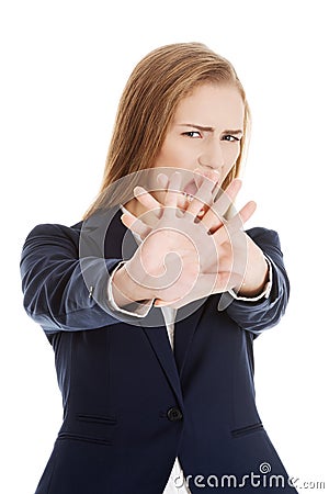 Beautiful caucasian business woman shows rejection and screams. Stock Photo