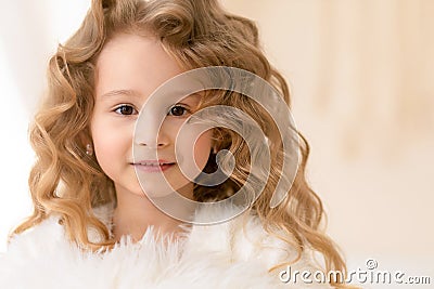 beautiful caucasian girl with long curly white hair, brown eyes. human, child emotions Stock Photo