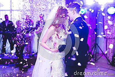 Beautiful caucasian wedding couple just married and dancing their first dance Stock Photo