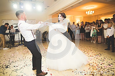 Beautiful caucasian wedding couple just married and dancing their first dance Stock Photo