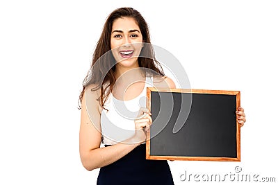 Beautiful Caucasian woman holding empty blackboard over white background Stock Photo