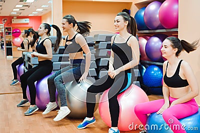 Beautiful caucasian women doing exercise with gymnastic ball Stock Photo