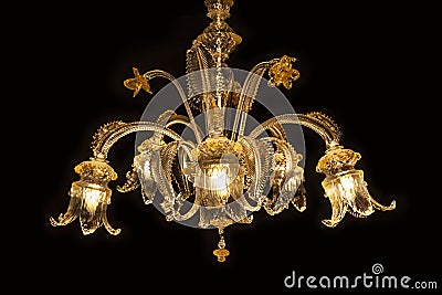 Beautiful chandelier (Murano Italy) isolated on black background. Stock Photo