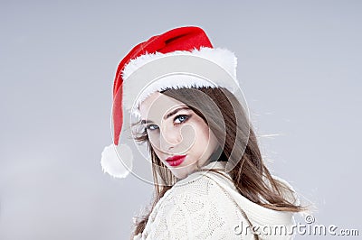 Beautiful charming girl wearing santa hat. Stock Photo