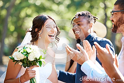 Beautiful cheerful bride greeting and socialising with friends and family. Guests congratulating the bride on her Stock Photo
