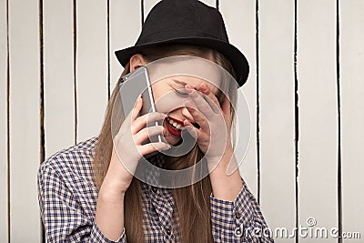 Beautiful, cheerful, joyful,happy girl in shirt and hat Stock Photo